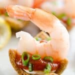 Light Shrimp Cocktail Bites are the perfect finger food to celebrate a holiday party. These individual bites of shrimp cocktail are lightened up with reduced fat cream cheese and Greek yogurt for a delicious and guilt free finger food you can enjoy!