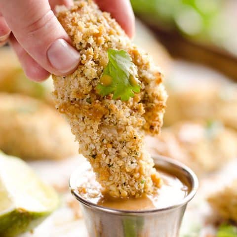 Light Thai Peanut Chicken Tenders are a healthy dinner idea bursting with bold and spicy Thai peanut flavors, paired with a simple two-ingredient sauce with creamy coconut milk!