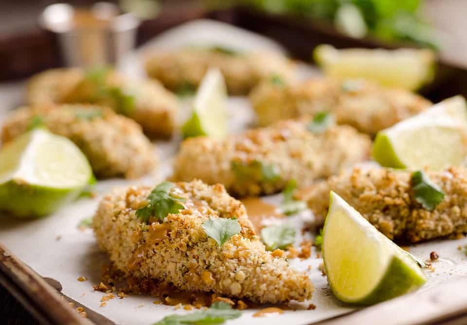 Light Thai Peanut Chicken Tenders are a healthy dinner idea bursting with bold and spicy Thai peanut flavors, paired with a simple two-ingredient sauce with creamy coconut milk!