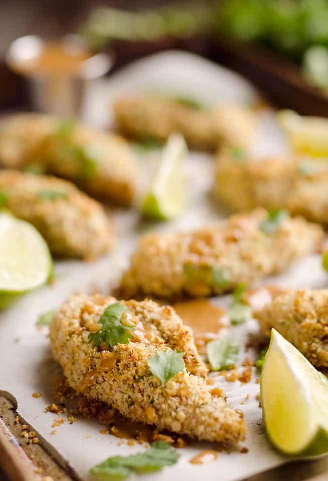 Light Thai Peanut Chicken Tenders are a healthy dinner idea bursting with bold and spicy Thai peanut flavors, paired with a simple two-ingredient sauce with creamy coconut milk!