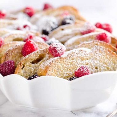 Overnight Berry French Toast Bake is a scrumptious dish so easy to make with a few simple ingredients, including your favorite coffee creamer, International Delight! Throw it together the night before and toss it in the refrigerator so it is ready to bake for your holiday breakfast or brunch!