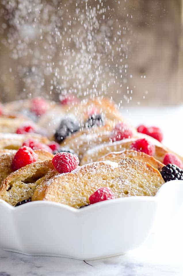 Overnight Berry French Toast Bake is a scrumptious dish so easy to make with a few simple ingredients, including your favorite coffee creamer, International Delight! Throw it together the night before and toss it in the refrigerator so it is ready to bake for your holiday breakfast or brunch!