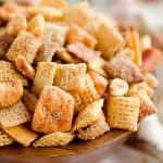 Zesty 3 Cheese Snack Mix is the perfect treat for the holidays with Chex Mix, nuts, cheesy crackers and pretzels coated in ranch seasoning, Parmesan and butter!