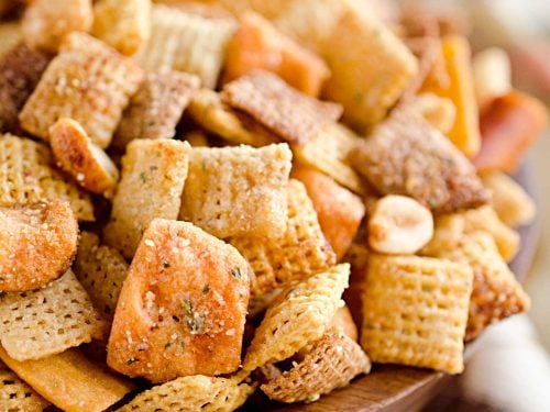 Zesty 3 Cheese Snack Mix is the perfect treat for the holidays with Chex Mix, nuts, cheesy crackers and pretzels coated in ranch seasoning, Parmesan and butter!