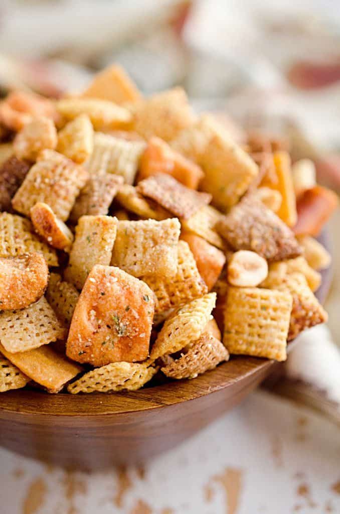 Zesty 3 Cheese Snack Mix is the perfect treat for the holidays with Chex Mix, nuts, cheesy crackers and pretzels coated in ranch seasoning, Parmesan and butter!