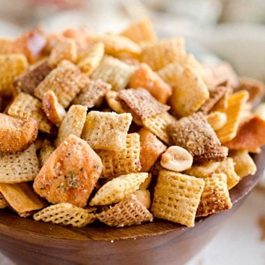 Zesty 3 Cheese Snack Mix is the perfect treat for the holidays with Chex Mix, nuts, cheesy crackers and pretzels coated in ranch seasoning, Parmesan and butter!