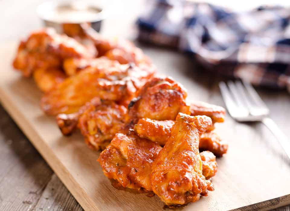 Baked Chipotle Ranch Wings are spicy chicken wings baked to crispy perfection in the oven with a dusting of Hidden Valley Ranch seasoning. These crispy wings are tossed in a delicious chipotle ranch sauce for a a lightened up game day favorite!