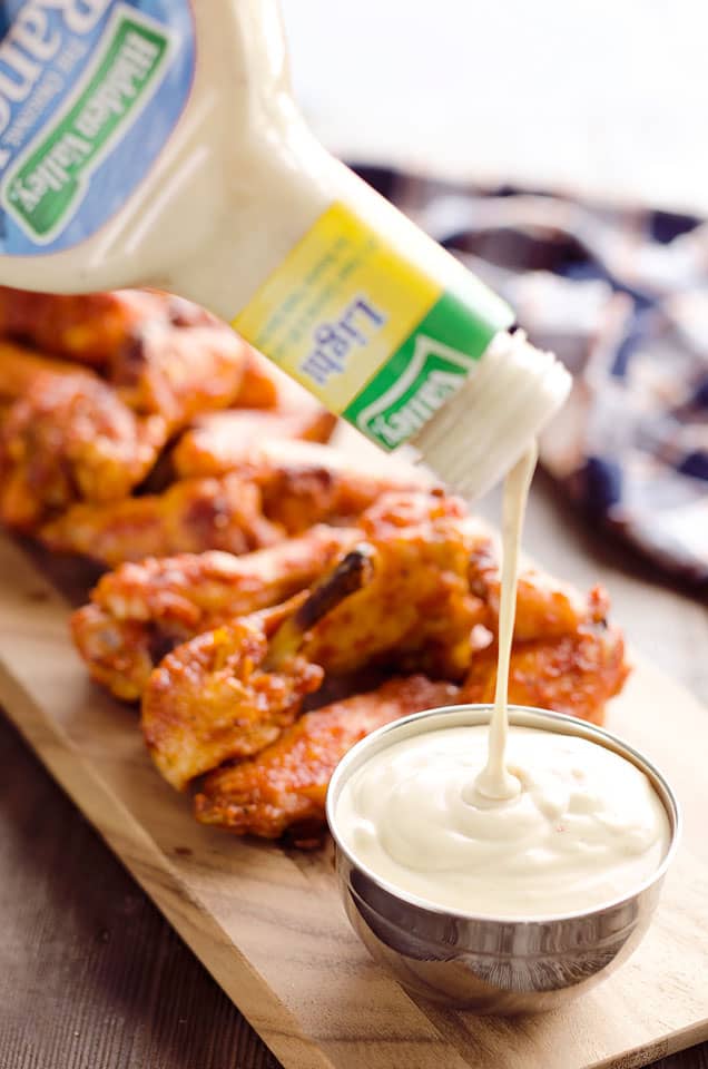 Baked Chipotle Ranch Wings are spicy chicken wings baked to crispy perfection in the oven with a dusting of Hidden Valley Ranch seasoning. These crispy wings are tossed in a delicious chipotle ranch sauce for a a lightened up game day favorite!