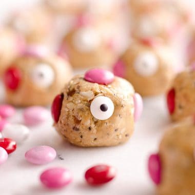 Love Monster Energy Bites are a healthy treat perfect for your Valentine. Kids and adults will love these monsters loaded with peanut butter, chia seeds and almonds with a little bit of chocolate for a protein packed sweet!