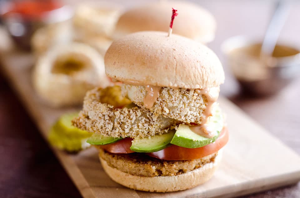 Skinny Cowgirl Veggie Burger is a hearty vegetarian meal loaded with bold flavor and crunch from homemade baked onion rings, smothered in a Greek yogurt and BBQ sauce, all topping your favorite veggie burger. 