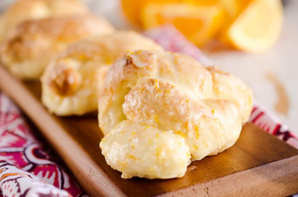 sweet orange roll knots on platter