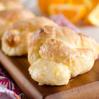 Sweet Roll Orange Knots are an easy and delicious breakfast idea that have all the flavors and light airy texture of a homemade dough, but are made easy with store-bought sweet roll dough!