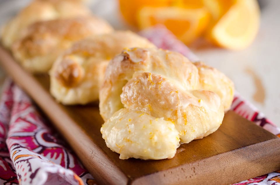 Sweet Roll Orange Knots are an easy and delicious breakfast idea that have all the flavors and light airy texture of a homemade dough, but are made easy with store-bought sweet roll dough!