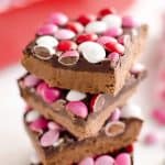 Triple Chocolate Peanut Butter No Bake Bars are a delicious dessert recipe ready in only 15 minutes. This sweet treat is perfect for Valentine's day or any time a peanut butter and chocolate craving strikes!