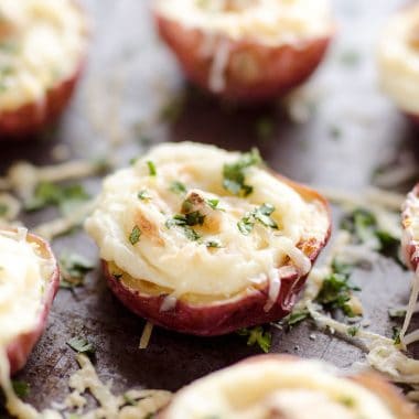 Twice Baked Ranch Potato Poppers are a crowd-pleaser with light and fluffy mashed potatoes mixed with Hidden Valley Ranch seasoning and light sour cream in a potato skin topped with shredded Parmesan for the perfect bite-sized appetizer!