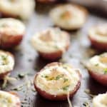 Twice Baked Ranch Potato Poppers are a crowd-pleaser with light and fluffy mashed potatoes mixed with Hidden Valley Ranch seasoning and light sour cream in a potato skin topped with shredded Parmesan for the perfect bite-sized appetizer!