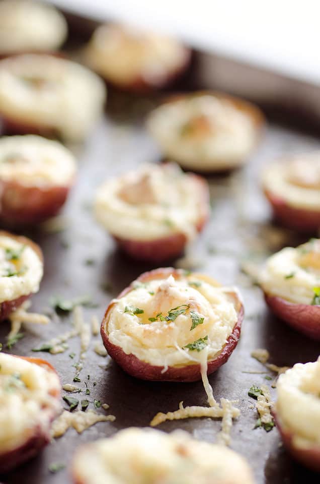 Twice Baked Ranch Potato Poppers are a crowd-pleaser with light and fluffy mashed potatoes mixed with Hidden Valley Ranch seasoning and light sour cream in a potato skin topped with shredded Parmesan for the perfect bite-sized appetizer!