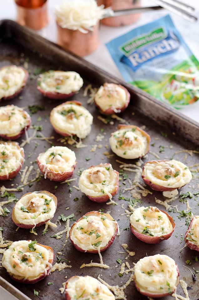 Twice Baked Ranch Potato Poppers are a crowd-pleaser with light and fluffy mashed potatoes mixed with Hidden Valley Ranch seasoning and light sour cream in a potato skin topped with shredded Parmesan for the perfect bite-sized appetizer!