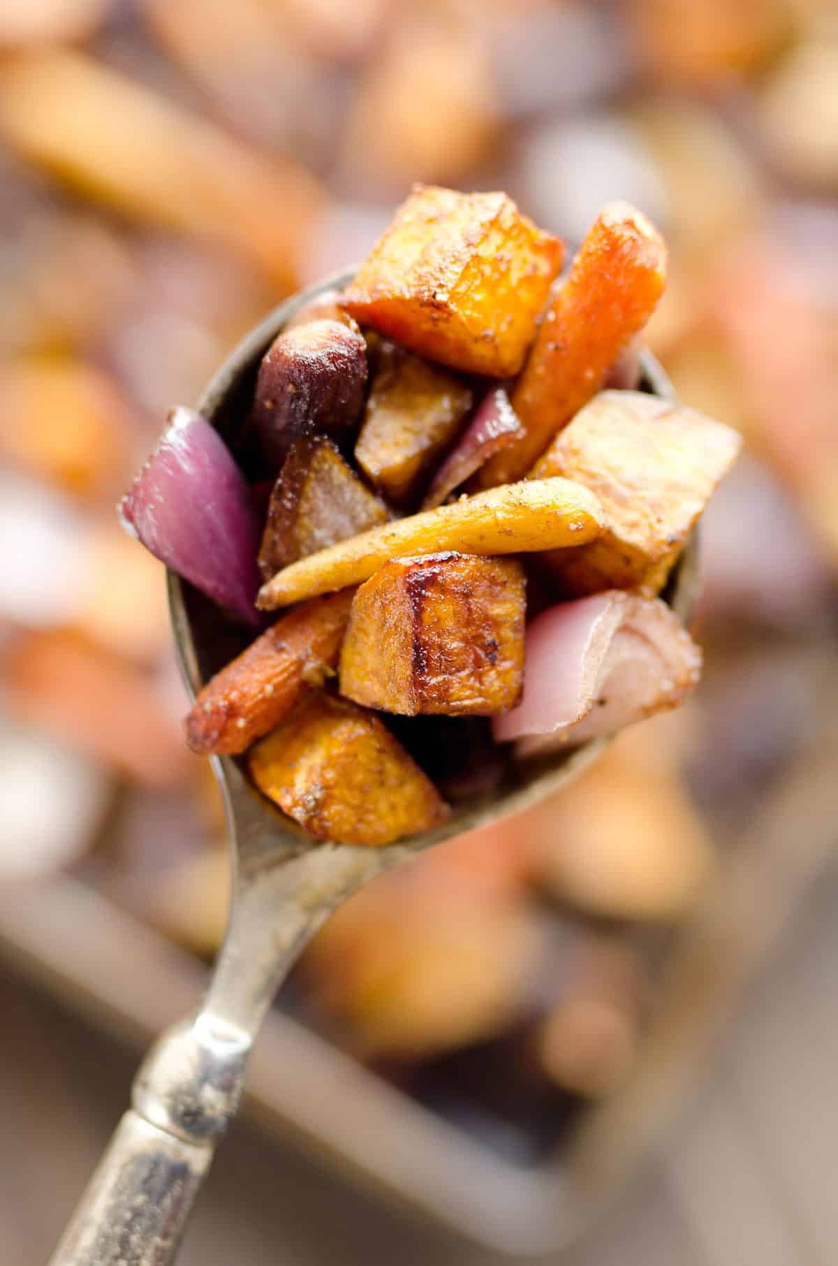 Balsamic Dijon Roasted Root Vegetables is an easy and healthy side dish bursting with tangy balsamic flavor and loaded with sweet potatoes, carrots and onions. 