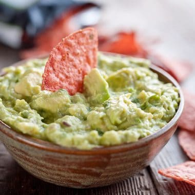 This Easy Guacamole Recipe comes together in minutes and is the perfect dip with salty chips or healthy accompaniment for chicken, shrimp or pork!