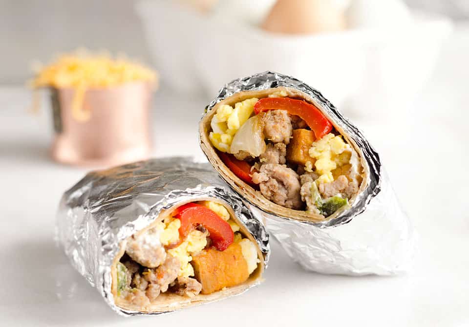 Light & Spicy Turkey Sausage Breakfast Burritos are a healthy freezer-friendly breakfast full of lean Jennie-O turkey sausage, scrambled eggs and roasted vegetables. Grab one from the freezer for a quick protein packed meal on the go or sit down with it to enjoy a hearty breakfast. 