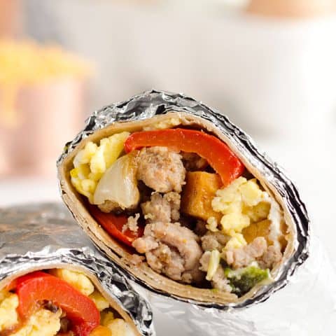 Light & Spicy Turkey Sausage Breakfast Burritos are a healthy freezer-friendly breakfast full of lean Jennie-O turkey sausage, scrambled eggs and roasted vegetables. Grab one from the freezer for a quick protein packed meal on the go or sit down with it to enjoy a hearty breakfast.