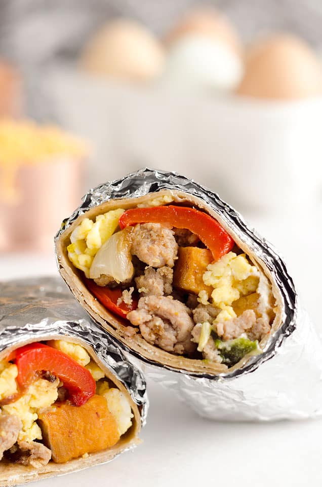 Light & Spicy Turkey Sausage Breakfast Burritos are a healthy freezer-friendly breakfast full of lean Jennie-O turkey sausage, scrambled eggs and roasted vegetables. Grab one from the freezer for a quick protein packed meal on the go or sit down with it to enjoy a hearty breakfast. 