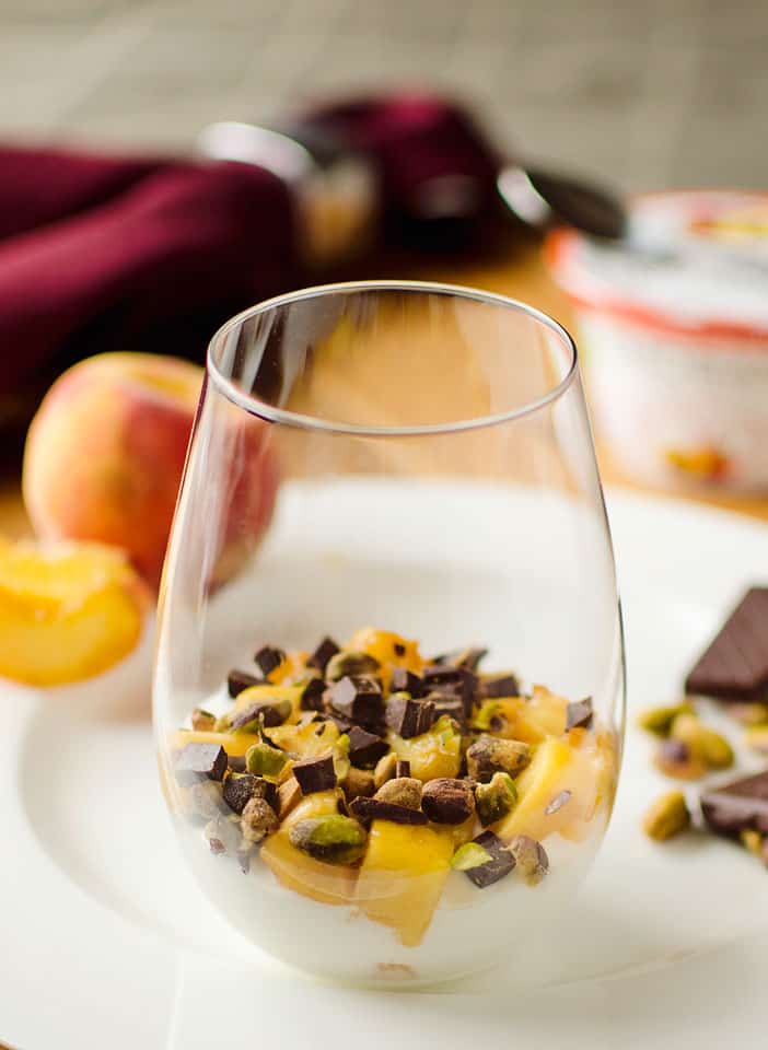 Peach Yogurt Parfait with pistachios and dark chocolate - The Creative Bite