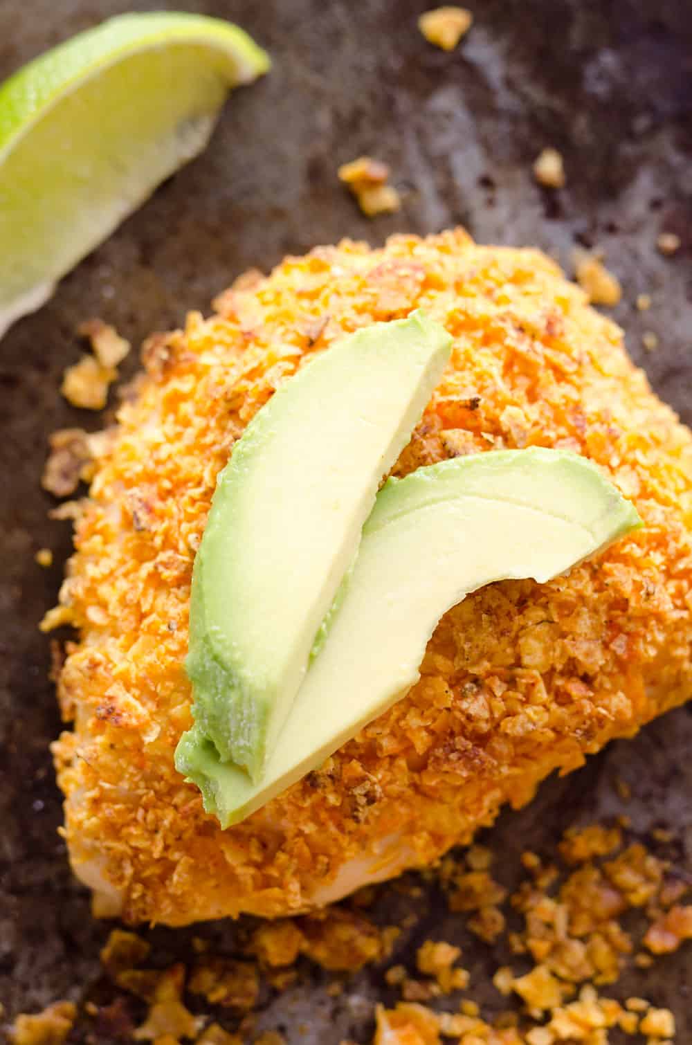 {3 Ingredient} Cheesy Dorito Chicken is a light and delicious dinner with tender chicken breasts stuffed with a creamy queso fresco cheese and coated in crunchy Dorito chips. 