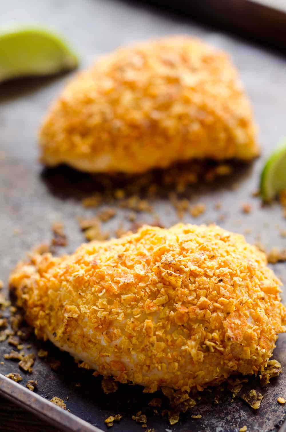 {3 Ingredient} Cheesy Dorito Chicken is a light and delicious dinner with tender chicken breasts stuffed with a creamy queso fresco cheese and coated in crunchy Dorito chips.