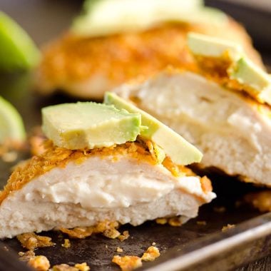 {3 Ingredient} Cheesy Dorito Chicken is a light and delicious dinner with tender chicken breasts stuffed with a creamy queso fresco cheese and coated in crunchy Dorito chips.