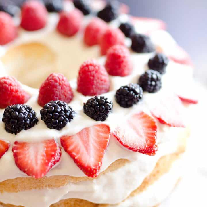 Light Berry Angel Food Cake is an easy and delicious 15 minute dessert. Angel food cake is layered with luscious white chocolate Cool Whip and topped with fresh berries for a guilt-free treat!