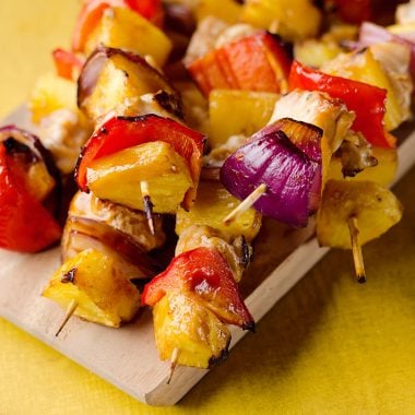 Teriyaki Chicken Kabobs are a healthy low-carb dinner bursting with flavor. These easy kabobs are prepared on the grill or in the oven and are loaded with lean chicken, bell peppers, onions and juicy pineapple for a balanced meal.