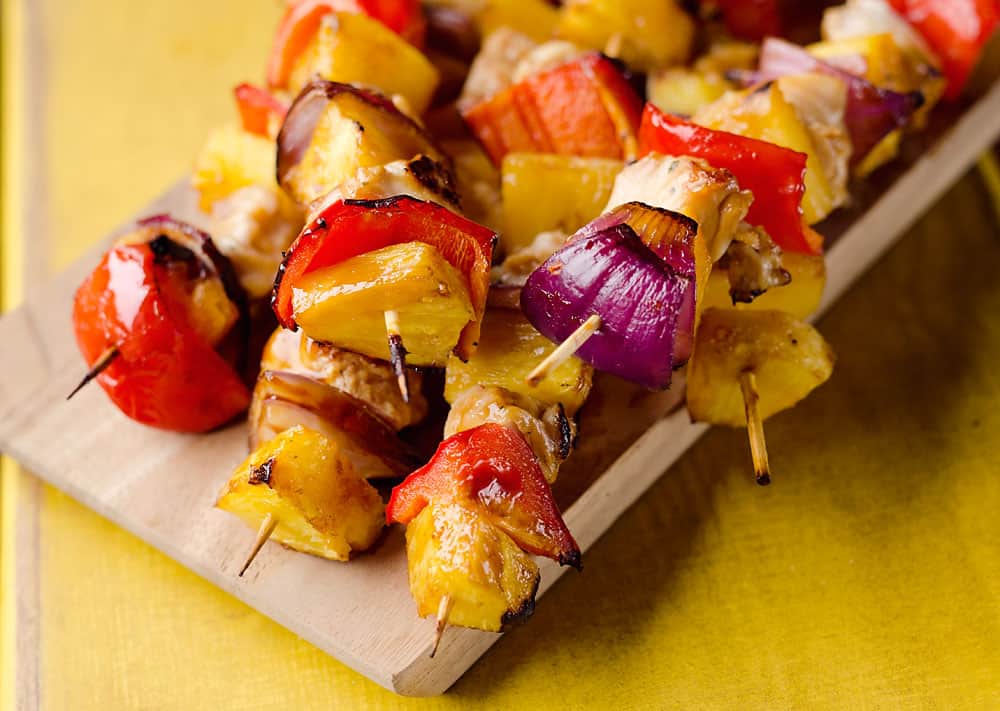 Teriyaki Chicken Kabobs are a healthy low-carb dinner bursting with flavor. These easy kabobs are prepared on the grill or in the oven and are loaded with lean chicken, bell peppers, onions and juicy pineapple for a balanced meal. 