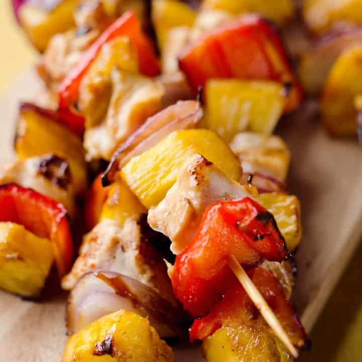 Teriyaki Chicken Kabobs are a healthy low-carb dinner bursting with flavor. These easy kabobs are prepared on the grill or in the oven and are loaded with lean chicken, bell peppers, onions and juicy pineapple for a balanced meal.