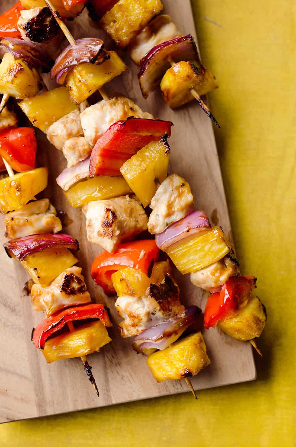 Teriyaki Chicken Kabobs are a healthy low-carb dinner bursting with flavor. These easy kabobs are prepared on the grill or in the oven and are loaded with lean chicken, bell peppers, onions and juicy pineapple for a balanced meal. 