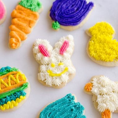 These Frosted Sugar Cookies are the best you will ever try! These adorable spring cut-outs have a cake-like softness topped with a rich buttercream frosting and the perfect balance of sweetness.