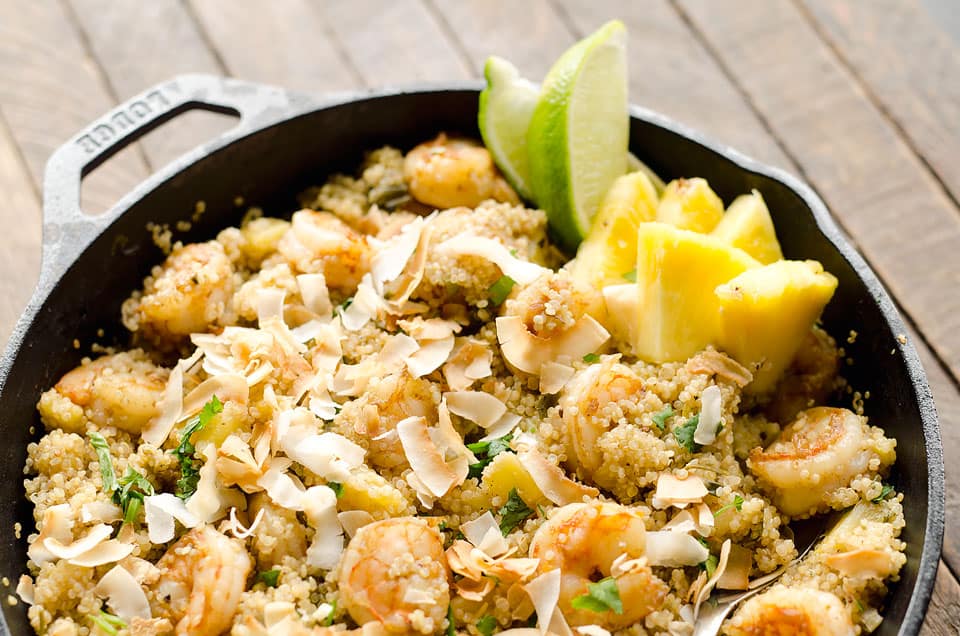 Light Coconut Shrimp & Pineapple Quinoa Skillet is a tropical dinner idea loaded with healthy ingredients. Quinoa, shrimp, pineapple and unsweetened coconut make up this flavorful and delicious dish for a healthy meal everyone will love. 