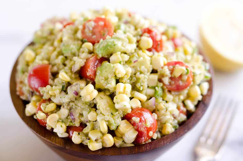 Cilantro Quinoa Corn Salad is a light and refreshing salad perfect for an easy packed lunch or a side salad for a cookout. This salad is a healthy combination of quinoa, corn, avocado and a light Cilantro Lemon dressing with a kick of spice from fresh jalapeños for a dish you will love! 