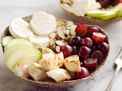 Fruit & Goat Cheese Chicken Bowls are a fresh and easy recipe for a healthy dinner loaded with sweet and savory flavors. Tender chicken breasts are paired with juicy grapes, apples, almonds and creamy honey goat cheese for an amazingly simple meal!