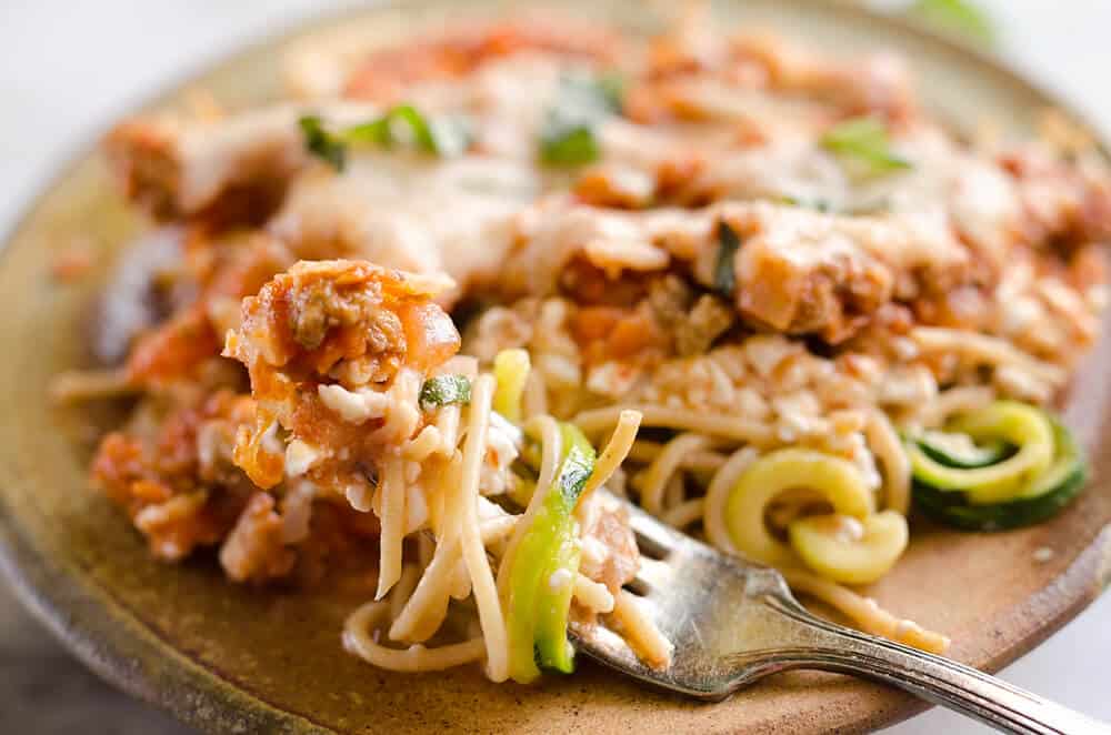 Light Turkey Noodle Casserole is a hearty and healthy dinner idea the whole family will love! All of the traditional flavors of noodle casserole are lightened up with whole wheat spaghetti, zucchini noodles and lean ground turkey. 