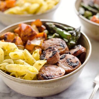Roasted Veggie & Chicken Sausage Penne Bowls are a healthy gluten free dinner recipe bursting with bold flavors and wholesome ingredients. From chipotle roasted sweet potatoes and Aidells Chicken & Apple Sausage to Barilla Gluten Free Penne Pasta tossed in pesto, this dish is a well-rounded and satisfying meal you will love.