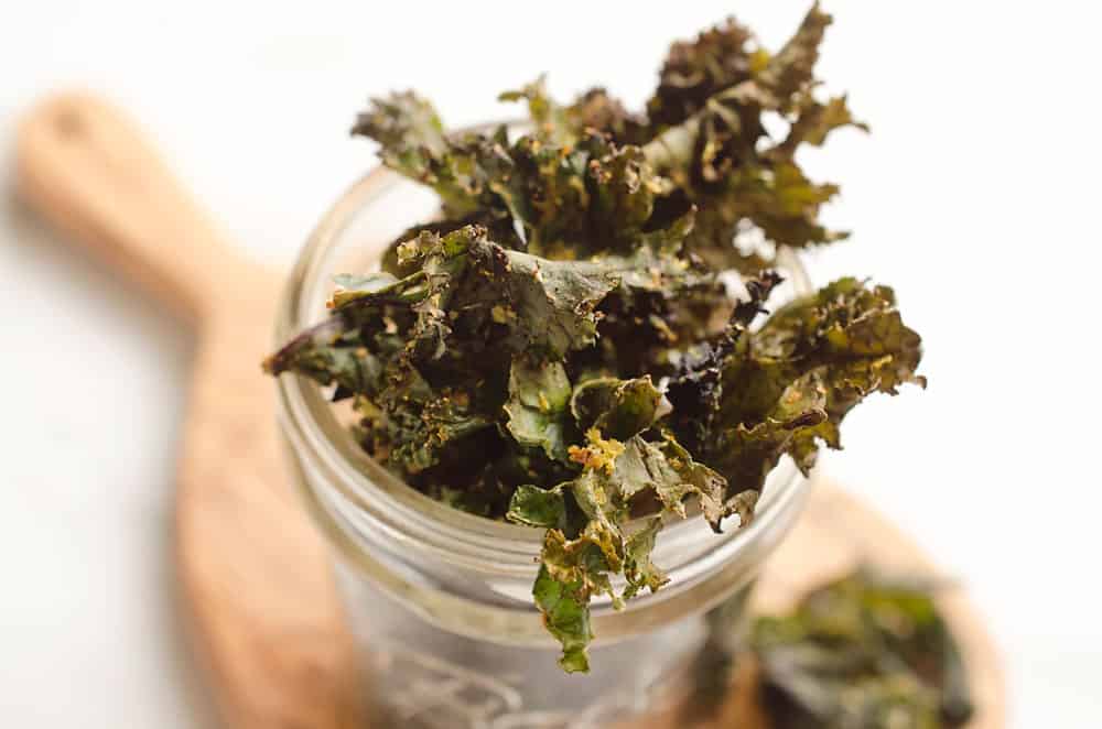 Spicy Kale Chips are beautifully crisp and loaded with bold chipotle flavor for a healthy snack. They are perfect for the munchies or paired with your favorite sandwich on the side!