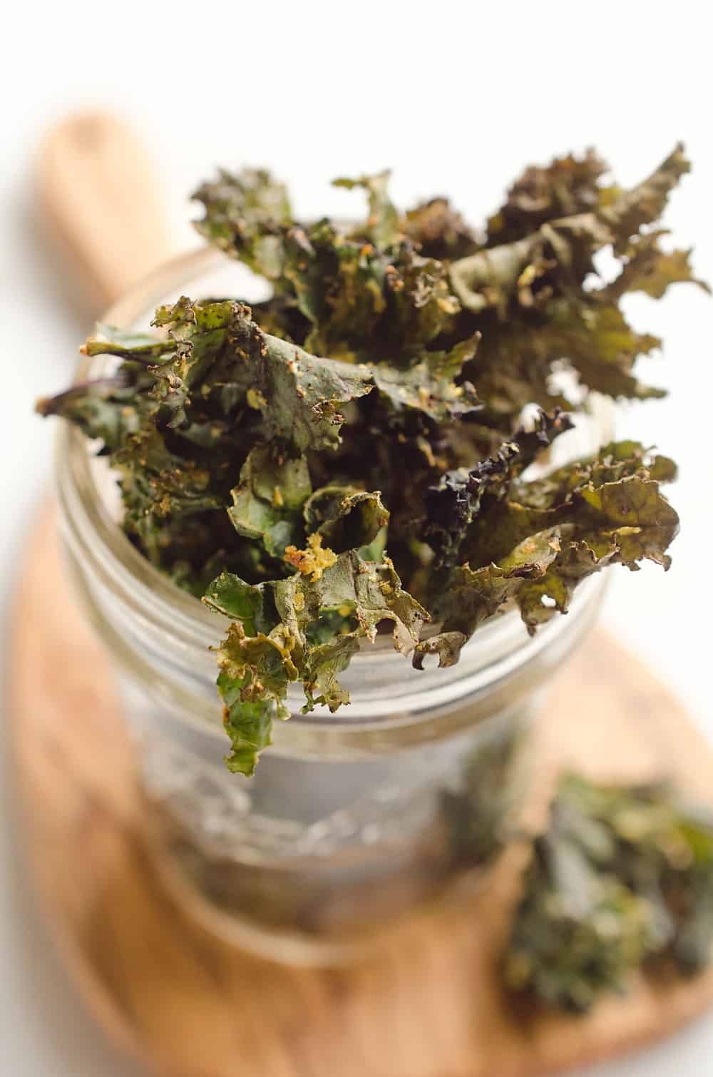 Spicy Kale Chips are beautifully crisp and loaded with bold chipotle flavor for a healthy 5 ingredient snack. They are perfect for the munchies or paired with your favorite sandwich on the side!