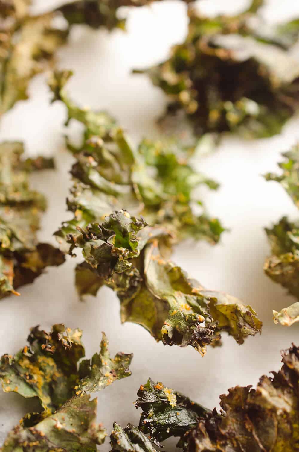 Spicy Kale Chips are beautifully crisp and loaded with bold chipotle flavor for a healthy 5 ingredient snack. They are perfect for the munchies or paired with your favorite sandwich on the side!