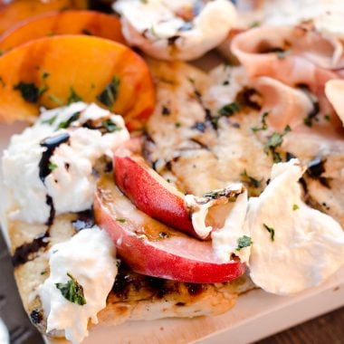 Balsamic Chicken with Peaches & Prosciutto is a deliciously simple and healthy dinner made on the grill in just 10 minutes! Grilled chicken is topped with fresh peaches and burrata cheese and finished off with a balsamic reduction and basil for a combination of flavors you will love.