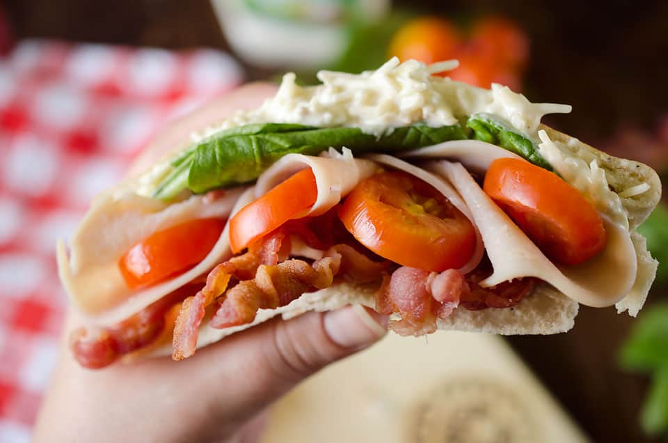 Parmesan Ranch Turkey BLT Pita is an easy and flavorful lunch loaded with bacon, lettuce, tomato, turkey and a delicious parmesan ranch. This sandwich recipe is perfect for a quick summer lunch everyone will love!