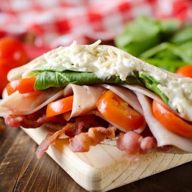 Parmesan Ranch Turkey BLT Pita is an easy and flavorful lunch loaded with bacon, lettuce, tomato, turkey and a delicious parmesan ranch. This sandwich recipe is perfect for a quick summer lunch everyone will love!