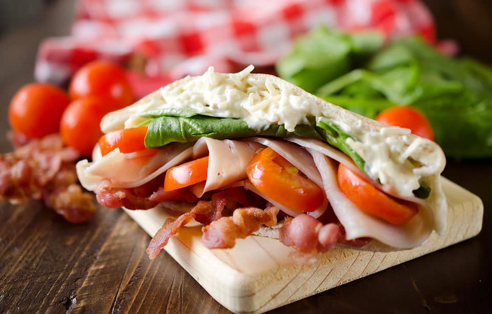 Parmesan Ranch Turkey BLT Pita is an easy and flavorful lunch loaded with bacon, lettuce, tomato, turkey and a delicious parmesan ranch. This sandwich recipe is perfect for a quick summer lunch everyone will love!