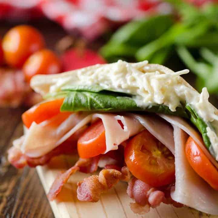 Parmesan Ranch Turkey BLT Pita is an easy and flavorful lunch loaded with bacon, lettuce, tomato, turkey and a delicious parmesan ranch. This sandwich recipe is perfect for a quick summer lunch everyone will love!